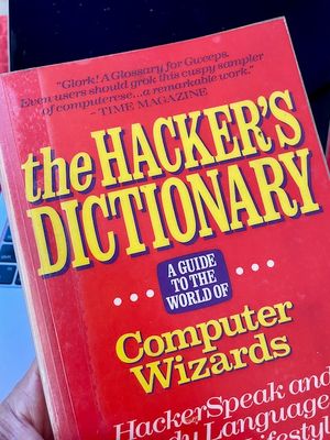 Vintage paperback copy of The Hacker's Dictionary. The cover reads The Hacker's Dictionary - a guide to the world of computer wizards.